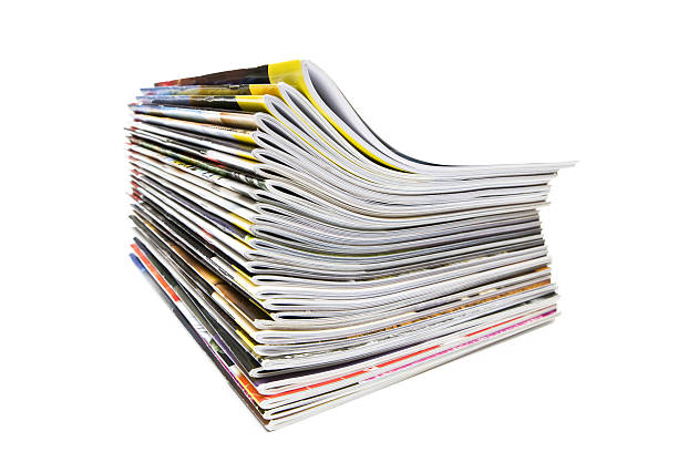 A pile of magazines on white background